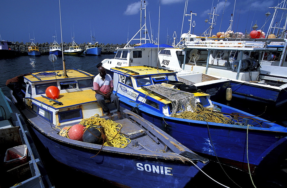 Caribbean, West Indies, Barbados, Bridgetown, Fishermen Harbour, Mr Funmaker Fisherman On His Boats Deck