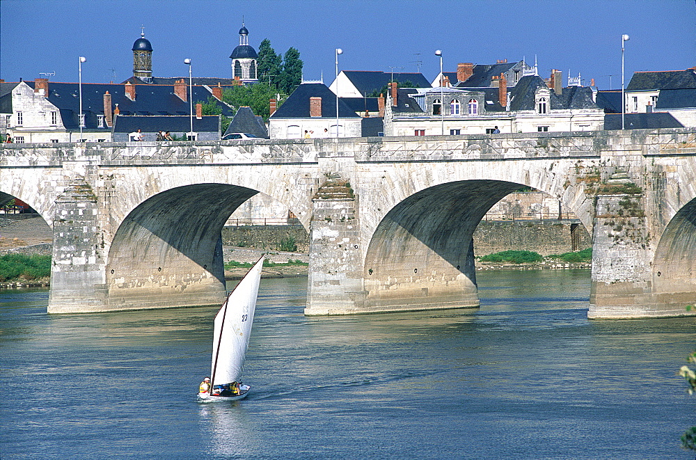 France, Val-De-Loire, Maine-Et-Loire, Saumur, Traditional Sailing Boat On River Loire, Saumur Stone Bridge At Back