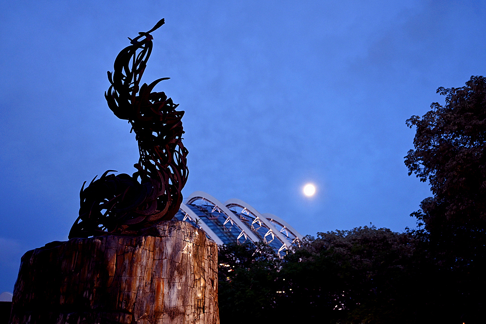 Metal sculpture and full moon