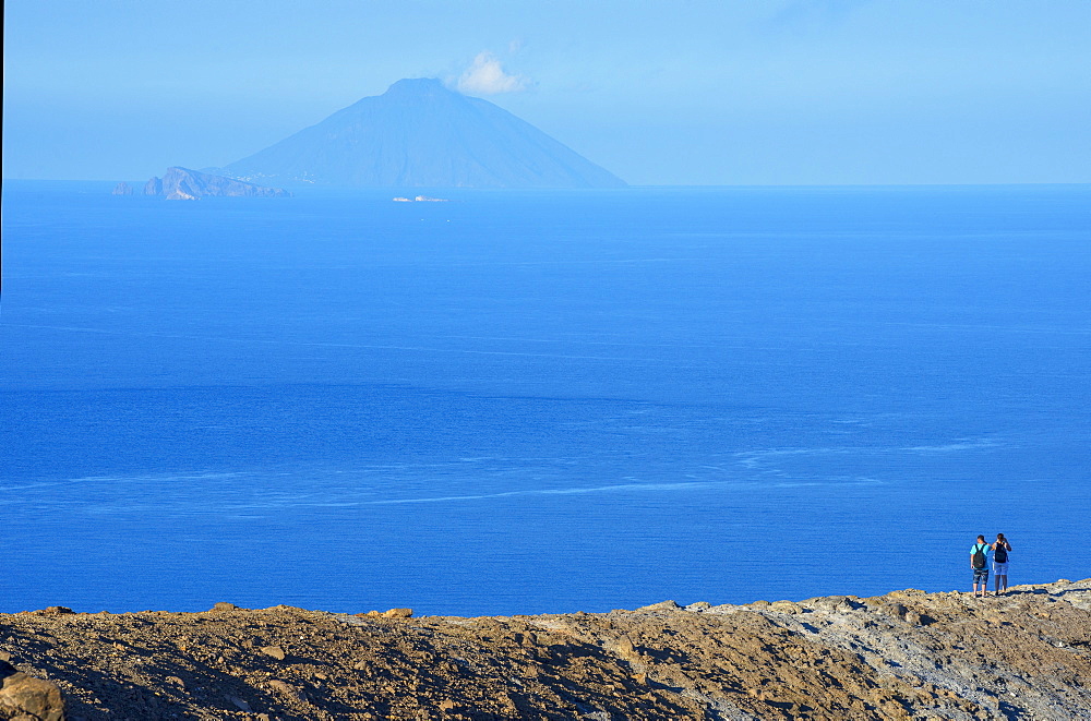 People looking at view of Stromboli island from Gran crater rim, Vulcano Island, Aeolian Islands, UNESCO World Heritage Site, Sicily, Italy, Mediterranean, Europe