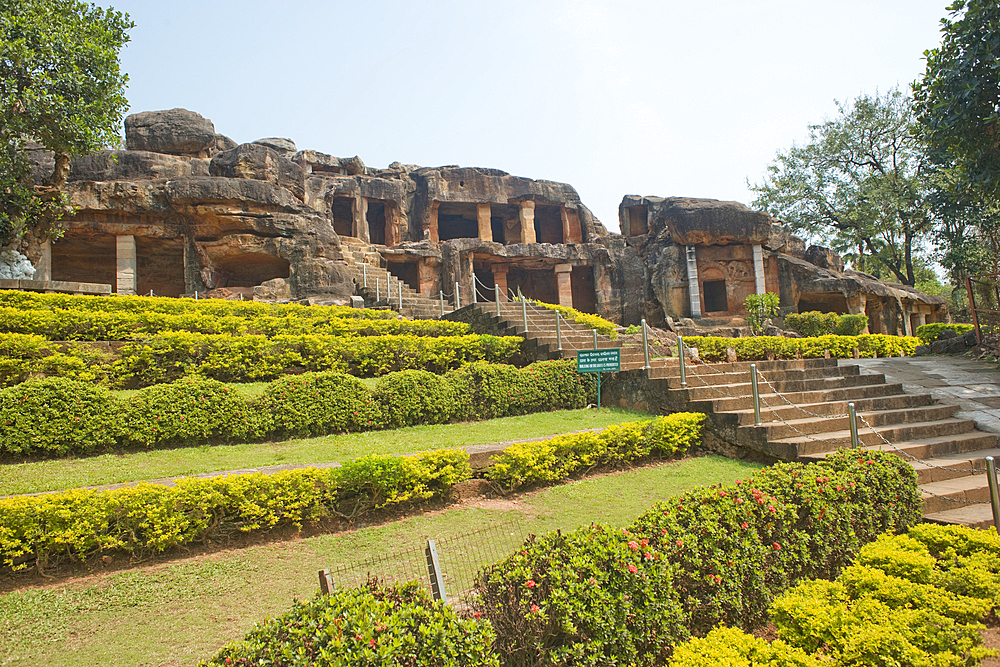 Garden at the entrance to the Udayagiri and Khandagiri caves dating back to over 100 years BCE, sculptured into the hillside as religious retreats for Jains, Bhubaneswar, Odisha, India, Asia