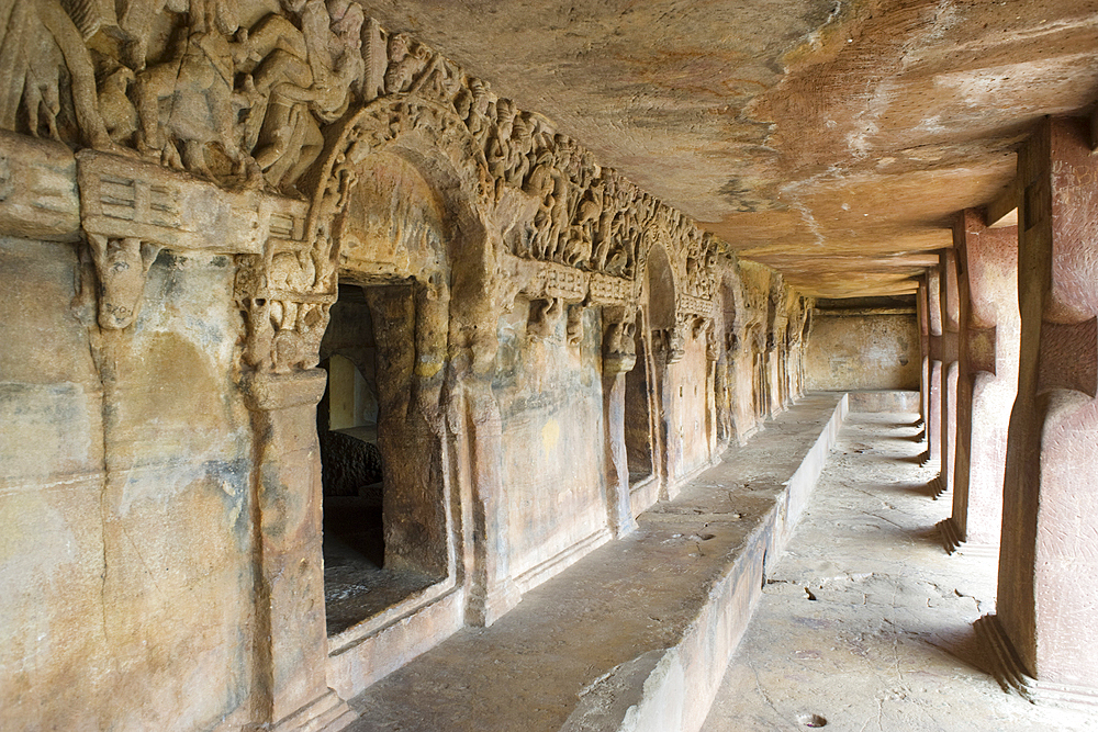 Monks' cells cut into the hillside rock among the Udayagiri and Khandagiri caves dating back to over 100 years BCE sculpted as religious retreats for Jain devotees, Bhubaneswar, Odisha, India, Asia