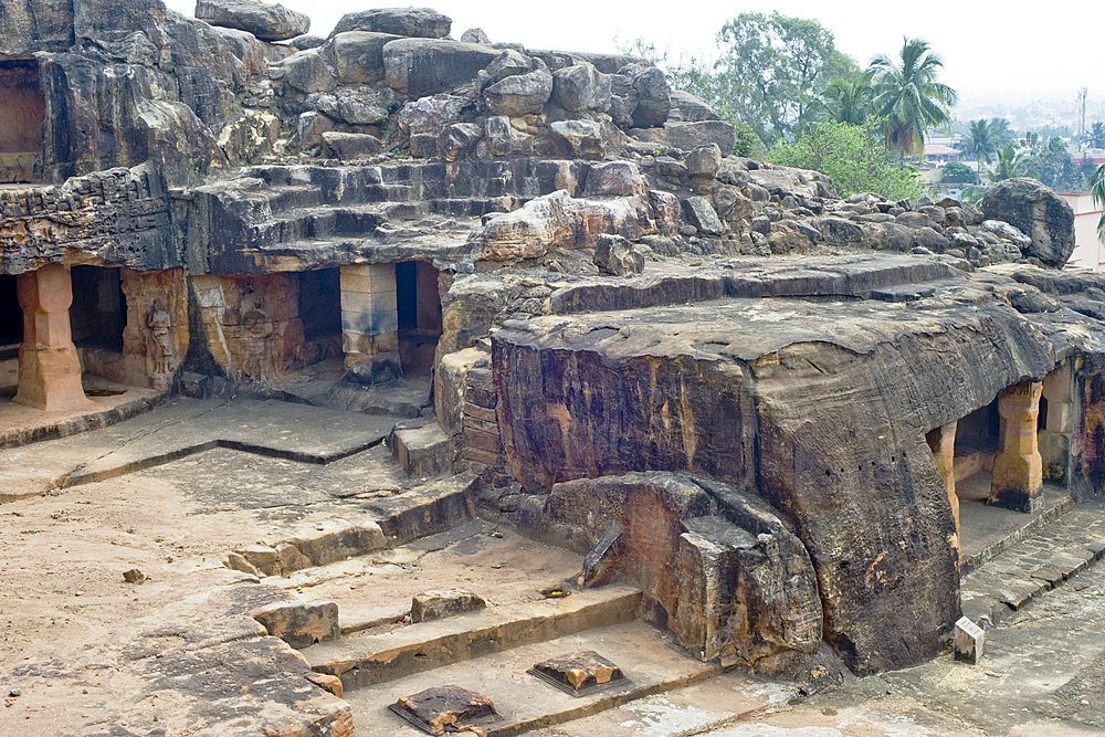 Monks' cells cut into the hillside rock among the Udayagiri and Khandagiri caves dating back to over 100 years BCE sculpted as religious retreats for Jain devotees, Bhubaneswar, Odisha, India, Asia