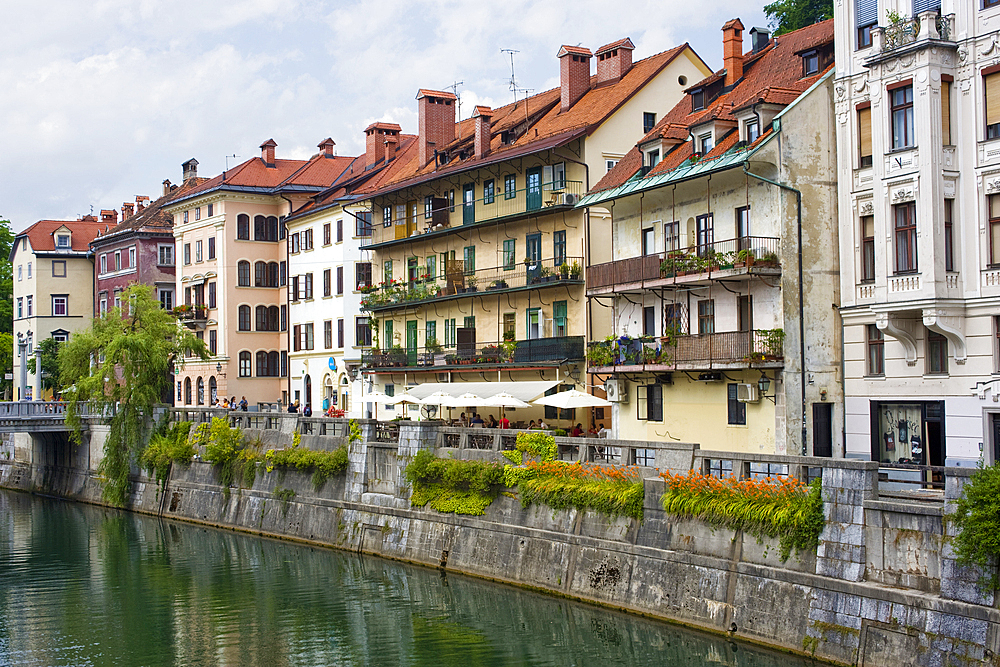 The embankment along a stretch of the River Ljubljanica leading to the city centre, Ljubljana, Slovenia, Europe