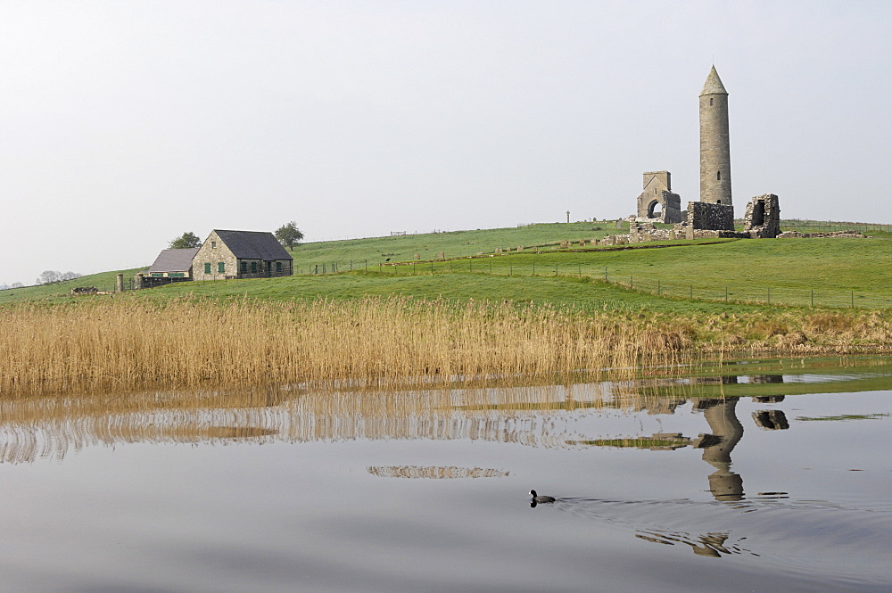 The Round Tower, 27m tall, used as belfry to call monks to prayer and to summon travellers at Devenish, a monastic settlement with a history from the 6th to the 16th century, Devenish Island, Lough (lake) Erne, Enniskillen, County Fermanagh, Ulster, Northern Ireland, United Kingdom, Europe