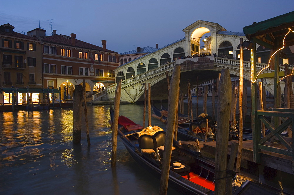 Grand Canal, Rialto Bridge at night, gondolas on waterfront, Venice, UNESCO World Heritage Site, Veneto, Italy, Europe