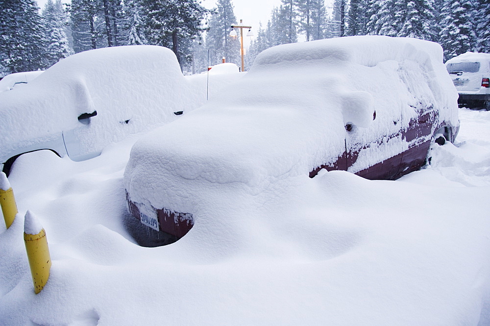 Cars under heavy snow fall at the winter ski resort, Lake Tahoe, California, United States of America, North America