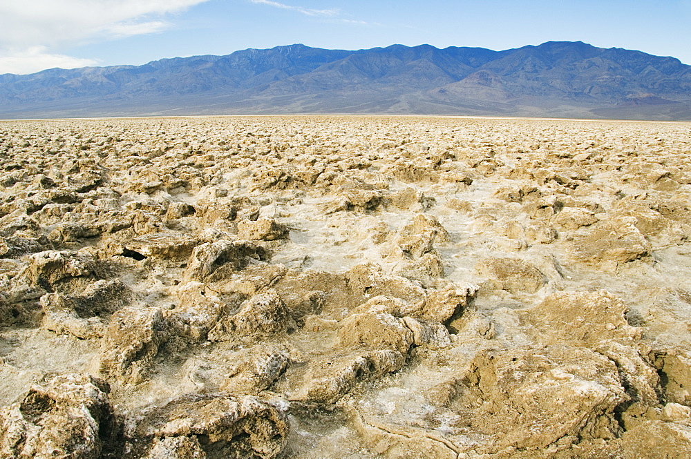 Crystaline deposit salt pillars in the corrugated Badlands landscape at Devils Golf Course, Death Valley National Park, California, United States of America, North America