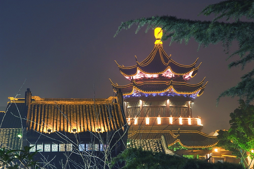 Pagoda and traditional architecture illuminated at night in Shantang water town, Suzhou, Jiangsu Province, China, Asia 