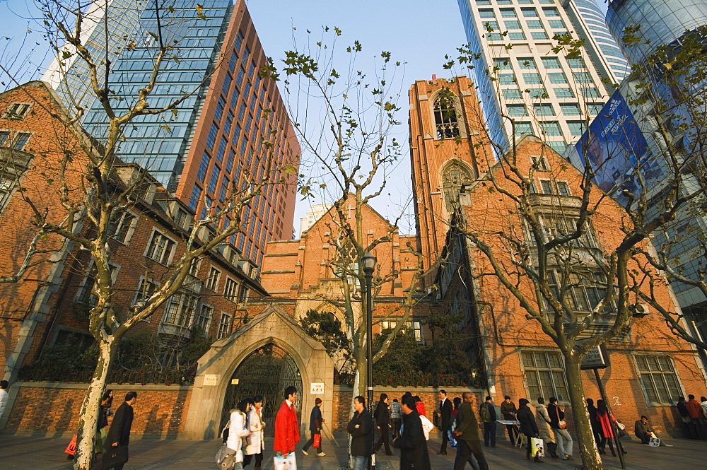 A Christian church among modern skyscrapers on Renmin Square, Puxi area, Shanghai, China, Asia