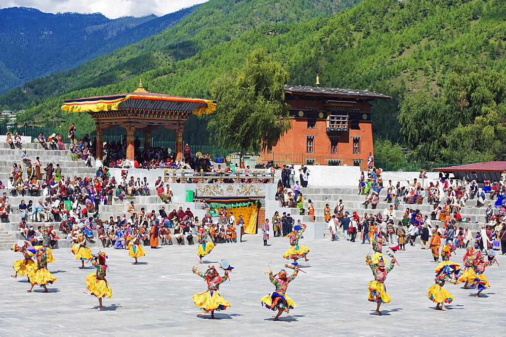 Dancers in traditional costume, Autumn Tsechu (festival) at Trashi Chhoe Dzong, Thimpu, Bhutan, Asia