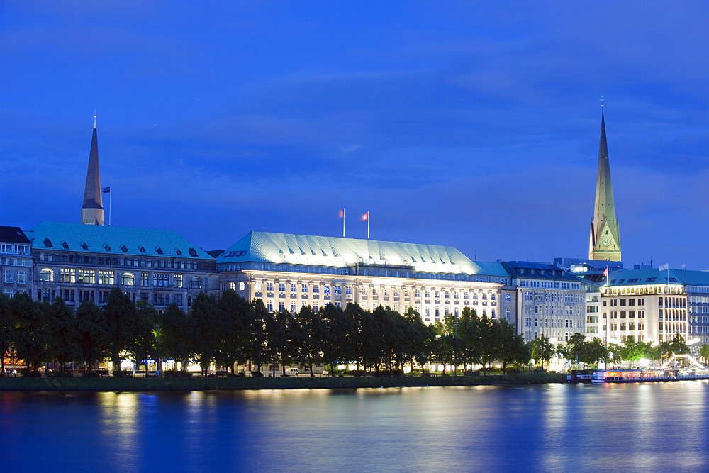 City illuminated at night on Lake Binnenalster, Hamburg, Germany, Europe