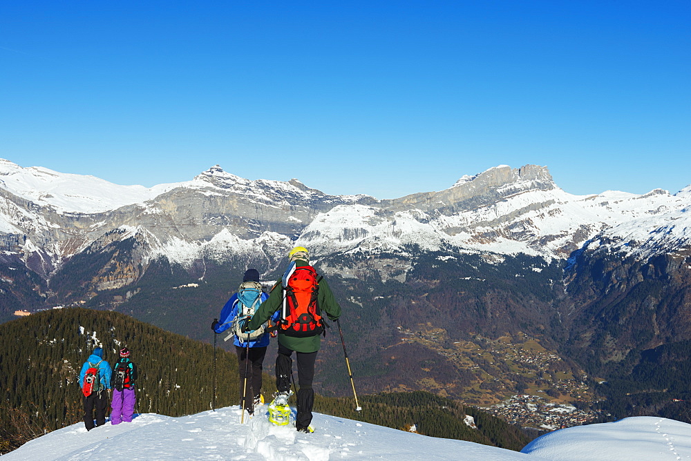 Snow shoeing at Les Houches, Chamonix Valley, Rhone Alps, Haute Savoie, France, Europe