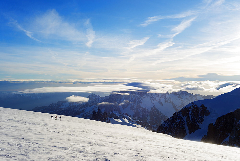 Ski tourer on Mont Blanc and Mont Blanc du Tacul, 4248m, behind, Chamonix, Rhone Alpes, Haute Savoie, France, Europe