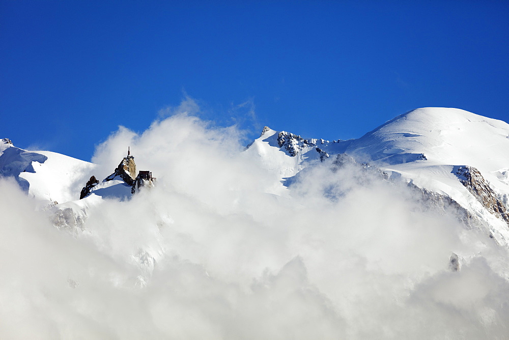 Mont Blanc, 4810m, and Aiguille du Midi cable car station, Chamonix, Haute Savoie, Rhone Alpes, French Alps, France, Europe