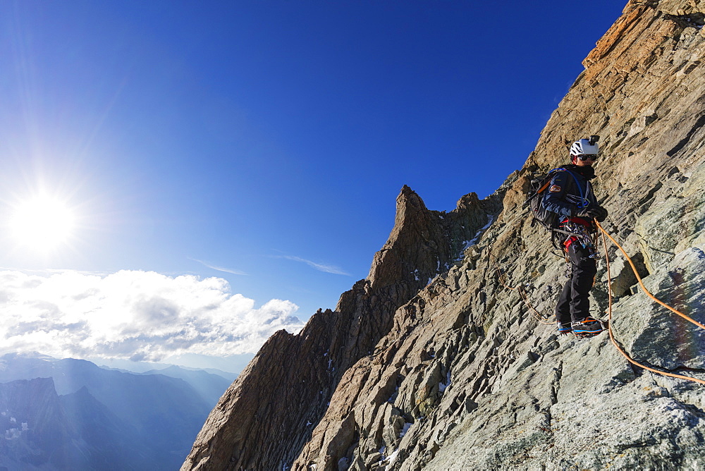 Climber on south ridge of Dent Blanche, 4357m, Valais, Swiss Alps, Switzerland, Europe