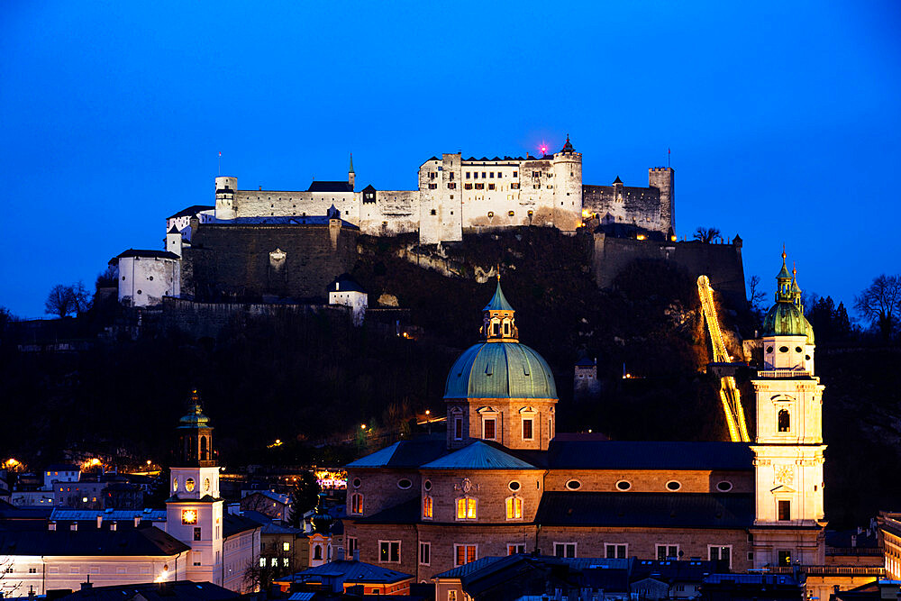 View of the old town, UNESCO World Heritage Site, and Hohensalzburg Castle at dusk, Salzburg, Austria, Europe