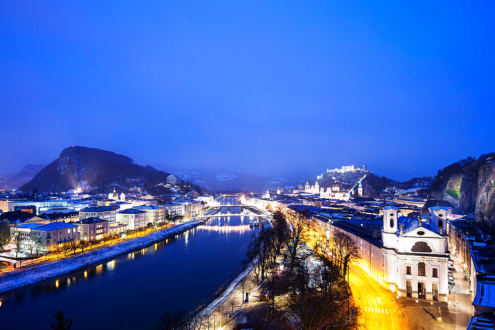 View over the old town, UNESCO World Heritage Site, Markus church and Hohensalzburg Castle at dusk, Salzburg, Austria, Europe