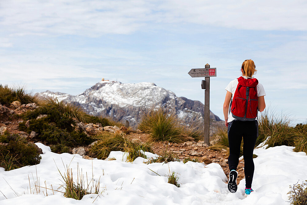 Serra de Tramuntura, hiker on Puig de Massanella, Mallorca's highest accessible peak, Majorca, Balearic Islands, Spain, Mediterranean, Europe