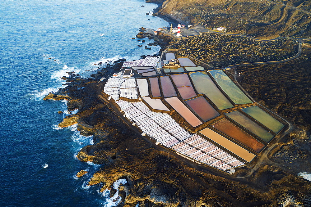 Aerial view of the salt pans and lighthouse at Faro de Fuencaliente. UNESCO Biosphere Site, La Palma, Canary Islands, Spain, Atlantic, Europe