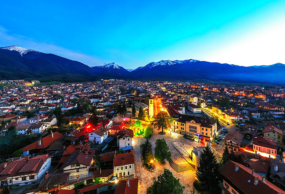 Aerial view by drone of Bansko old town and Pirin National Park, UNESCO World Heritage Site, Bankso, Bulgaria, Europe