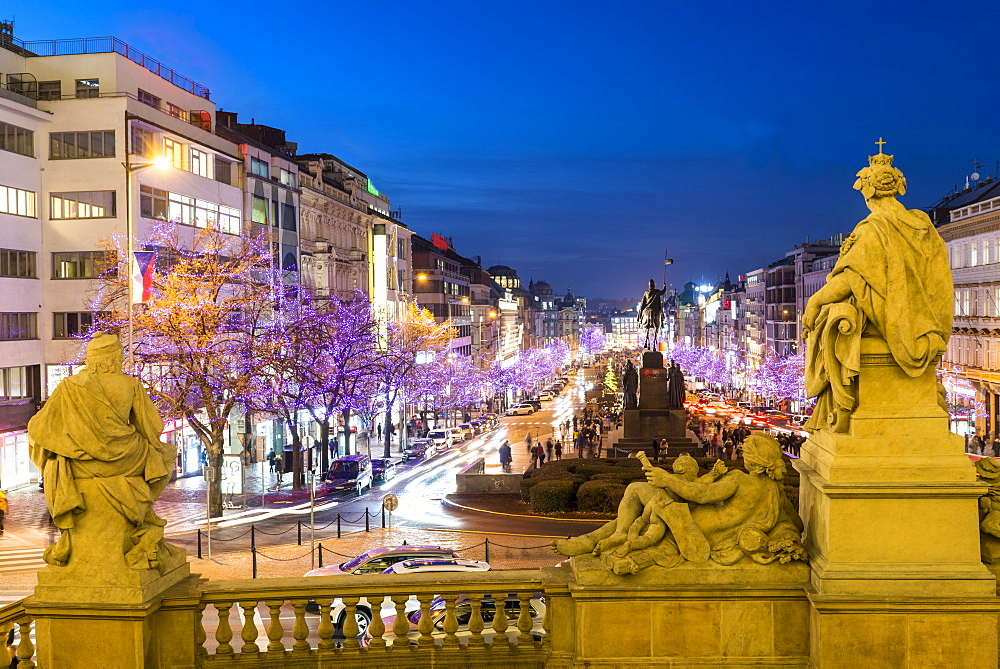 Christmas decorations and markets through statues of National Museum at Wenceslas Square, New Town, Prague, Czech Republic, Europe