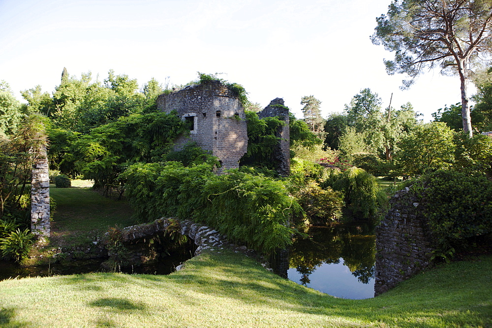 Ruins over the River Ninfa, the Gardens of Ninfa, Cisterna di Latina, Lazio, Italy, Europe