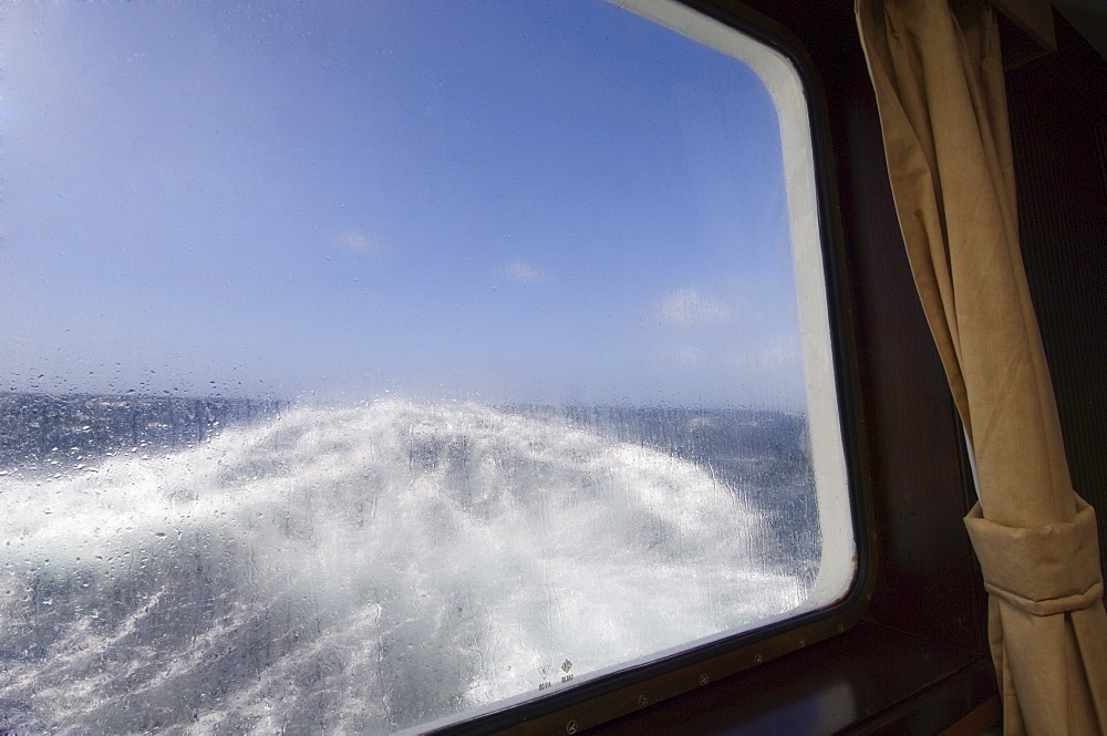 View from the cabin of the Antarctic Dream navigation in rough seas near Cape Horn, Drake Passage, Antarctic Ocean, South America