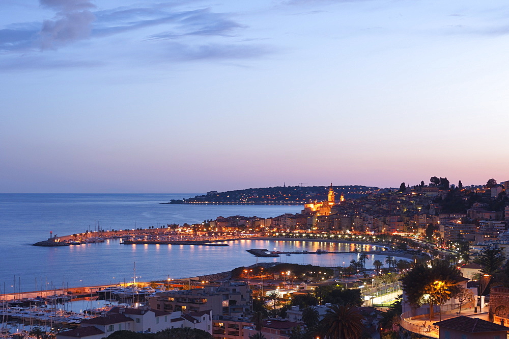 A cityscape of Menton at dusk, Provence-Alpes-Cote d'Azur, French Riviera, France, Mediterranean, Europe 