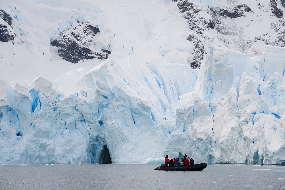 Tourists at the edge of ice shelf, Skontorp Cove, Paradise Bay, Antarctica, Polar Regions