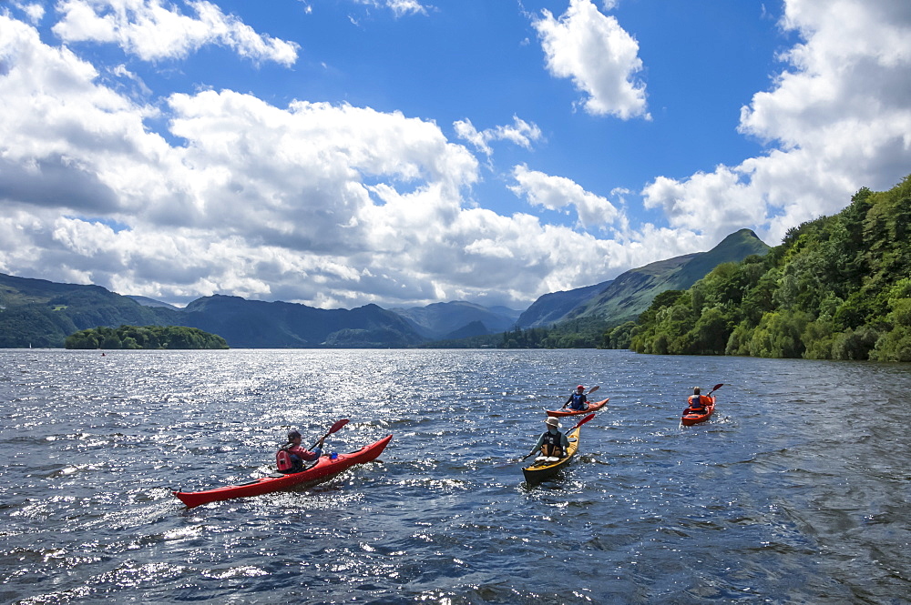 Canoes on Derwentwater, view towards Borrowdale Valley, Keswick, Lake District National Park, Cumbria, England, United Kingdom, Europe