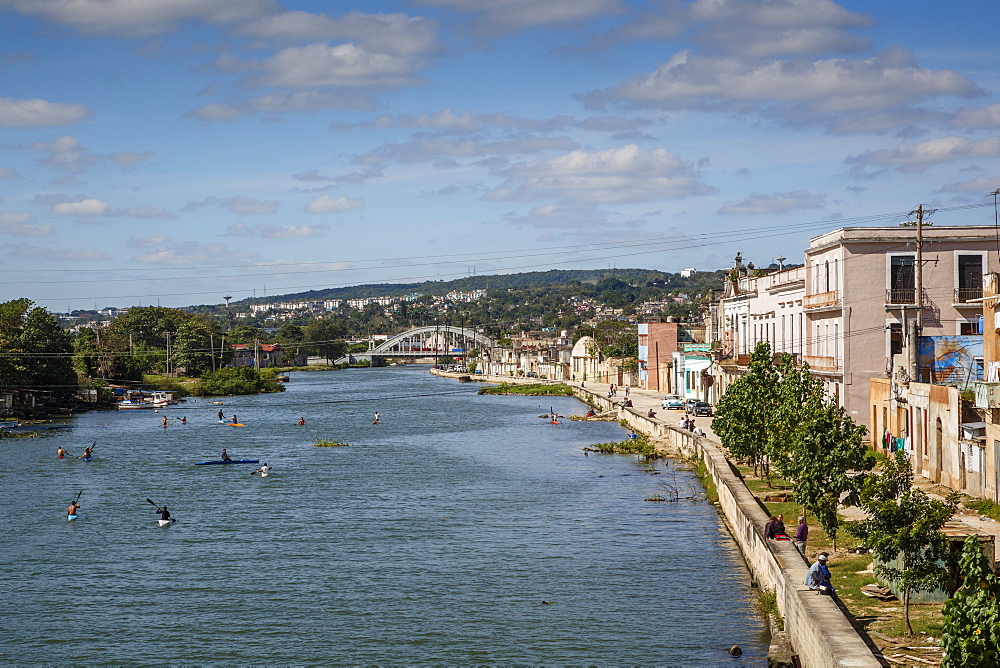 View over people kayaking in Rio San Juan and the city of Matanzas, Cuba, West Indies, Caribbean, Central America