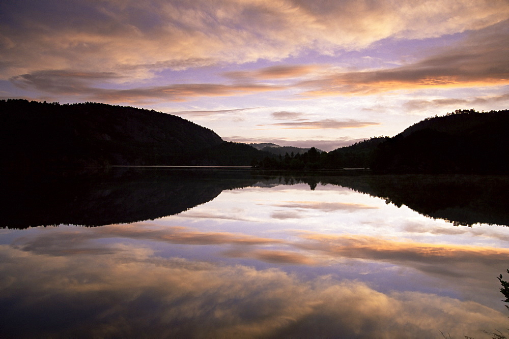 Pond reflection and clouds at dawn, Kristiansand, Norway, Scandinavia, Europe