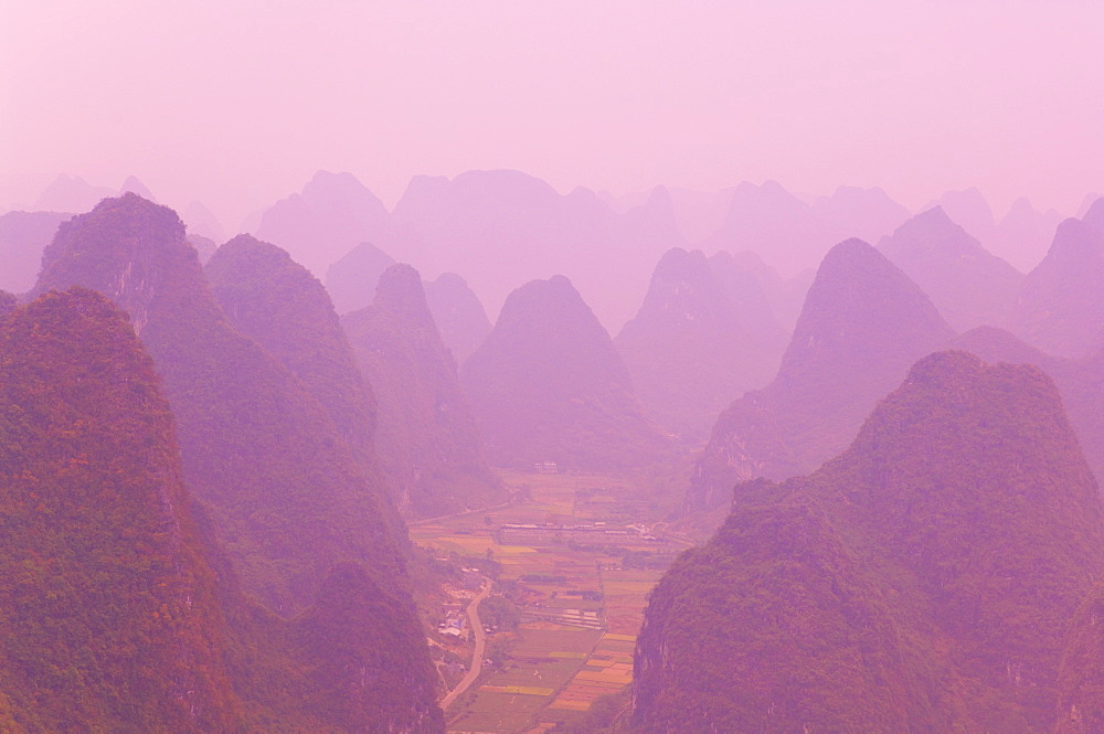 Karst landscape and haze, Yangshuo, Guangxi Province, China, Asia