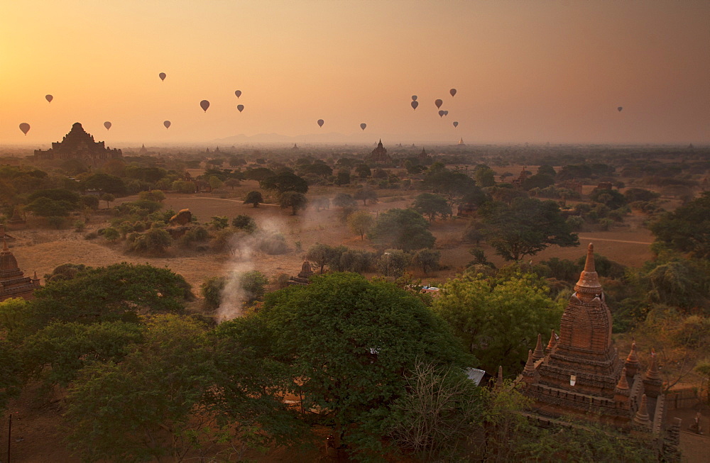 Hot air balloons at sunrise above Bagan (Pagan), Myanmar (Burma), Asia