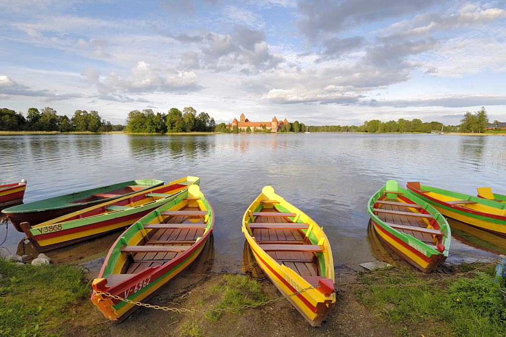 Colourful rowing boats and Trakai Castle, Trakai, near Vilnius, Lithuania, Baltic States, europe