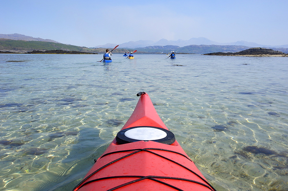 Sea kayaking near Arisaig, Highlands, Scotland, United Kingdom, Europe