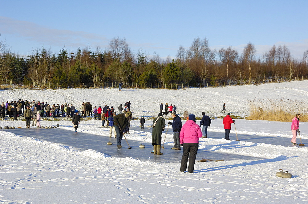 Curling on frozen Bush Loch, Gatehouse of Fleet, Dumfries and Galloway, Scotland, United Kingdom, Europe