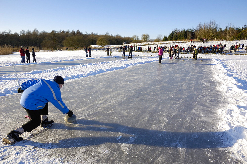 Curling on frozen Bush Loch, Gatehouse of Fleet, Dumfries and Galloway, Scotland, United Kingdom, Europe