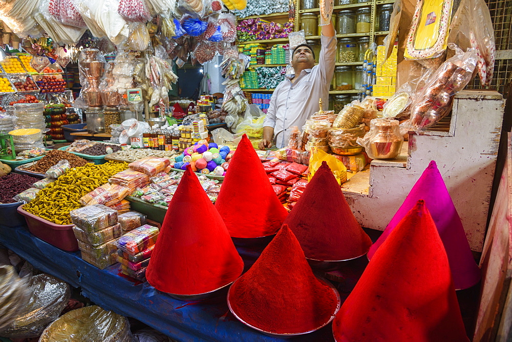 Vendor at food and spice stall at K. R. Market in Banaglore, Karnataka, India, Asia