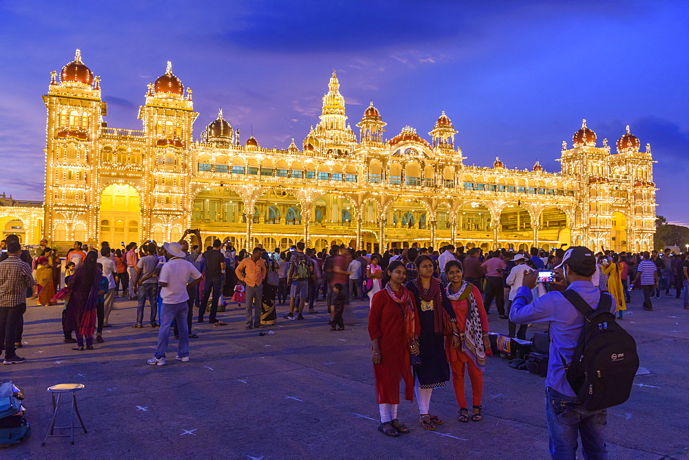 Family posing for photograph at Mysore Palace in Mysuru, Karnataka, India, Asia