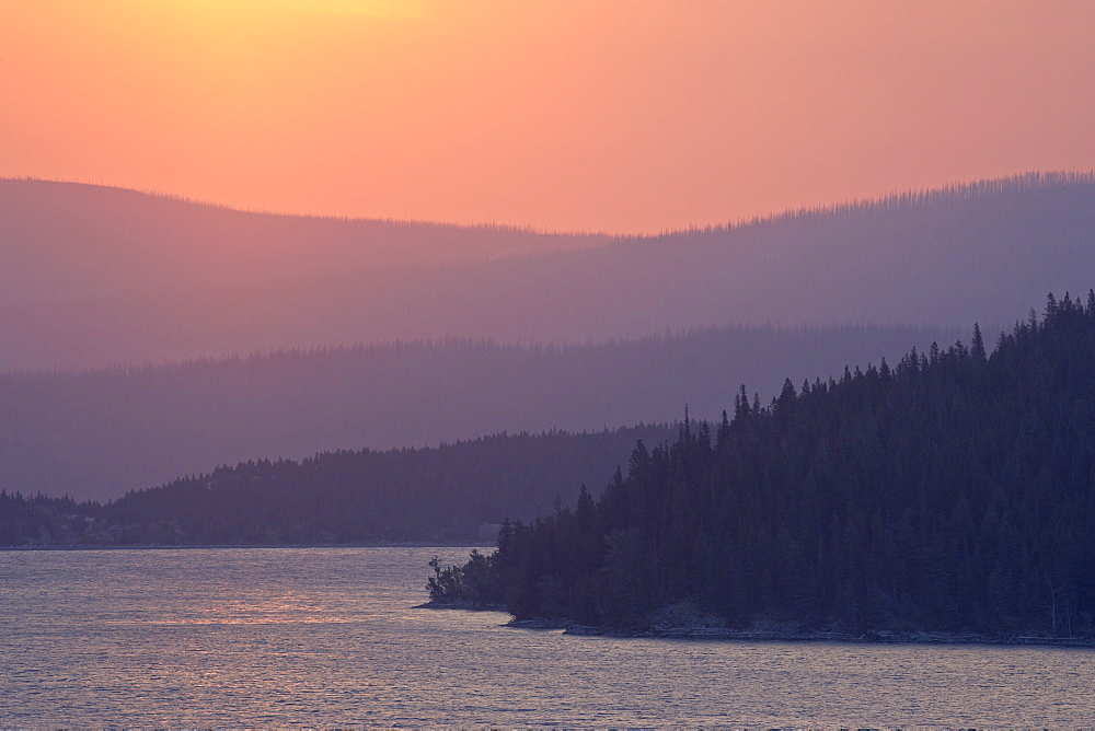 Red sky over St. Mary Lake at sunrise, Glacier National Park, Montana, United States of America, North America