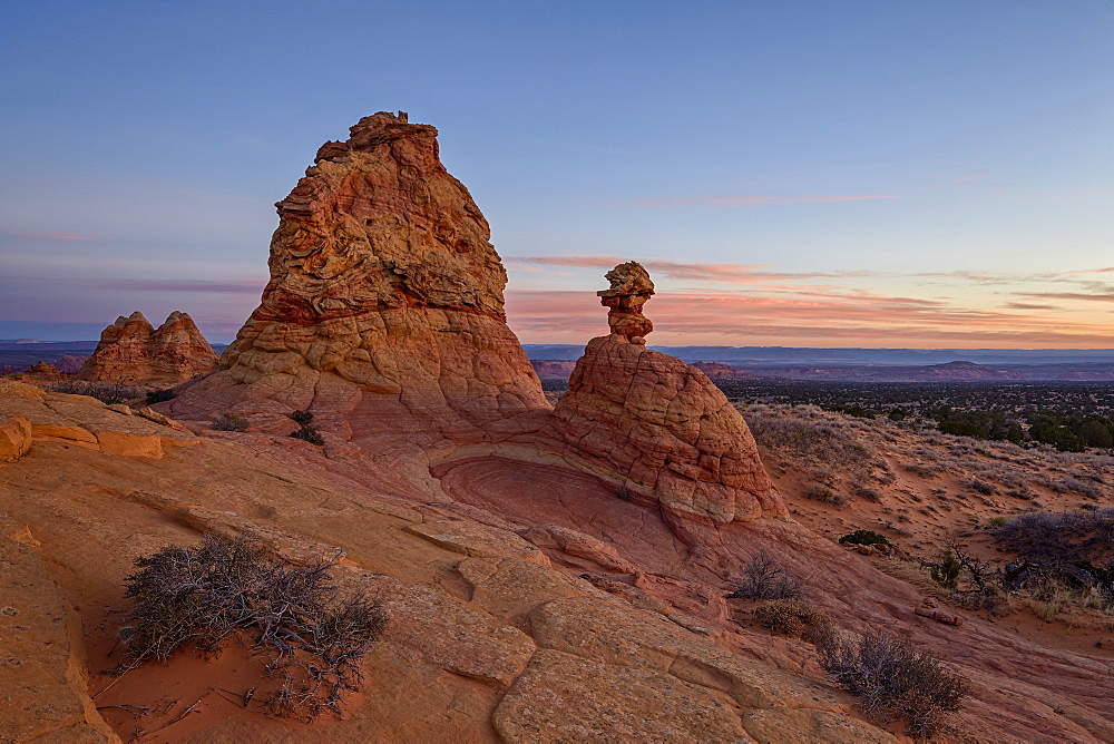 Sandstone formations at dawn with pink clouds, Coyote Buttes Wilderness, Vermilion Cliffs National Monument, Arizona, United States of America, North America