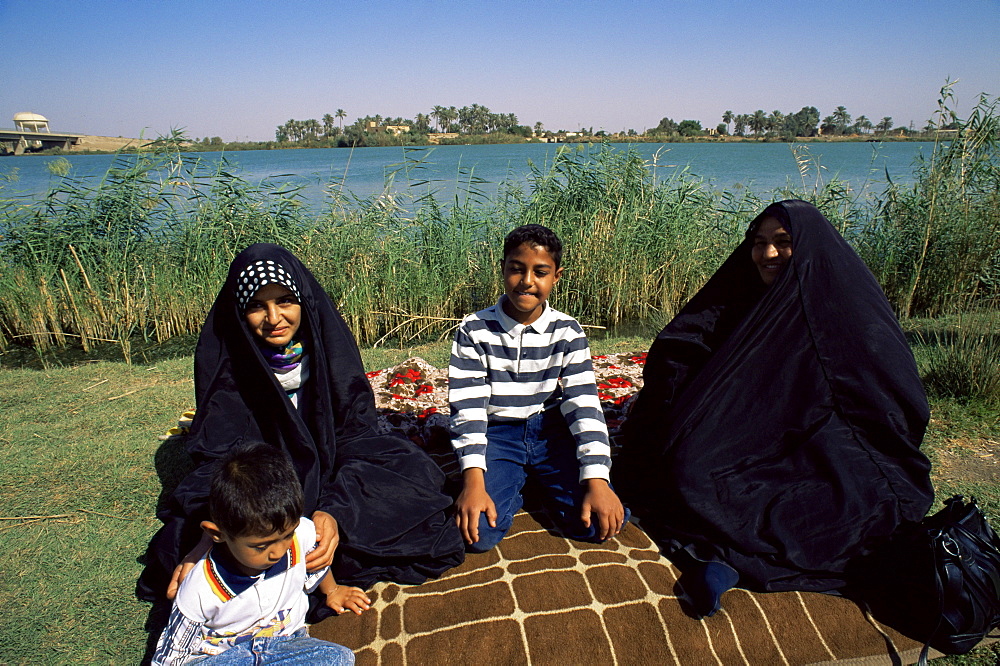 Family group beside the Tigris River, Iraq, Middle East