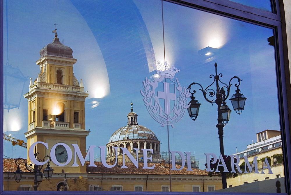 Piazza Garibaldi reflected in the glass of the Town Hall, Parma, Emilia Romagna, Italy, Europe