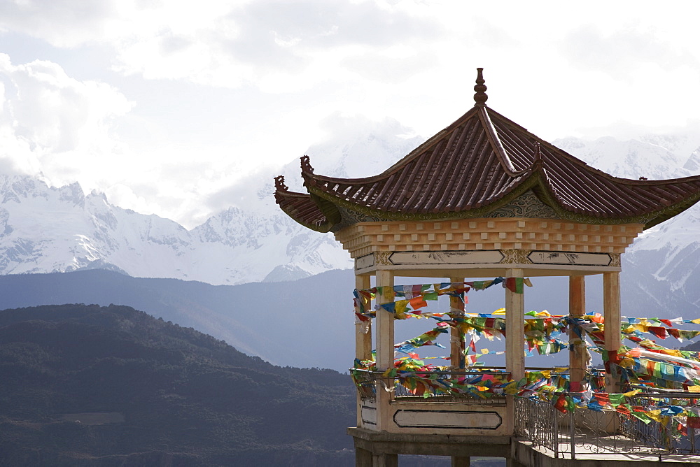 Buddhist stupa on way to Deqin, on the Tibetan Border, with the Meili Snow Mountain peak in the background, Dequin, Shangri-La region, Yunnan Province, China, Asia