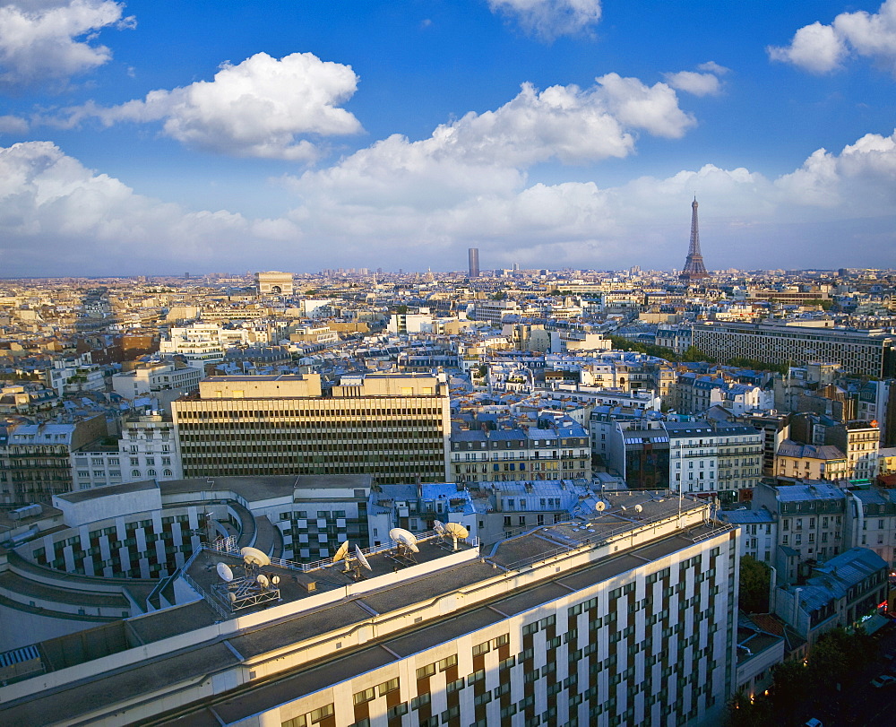 City with Eiffel Tower in distance, Paris, France, Europe