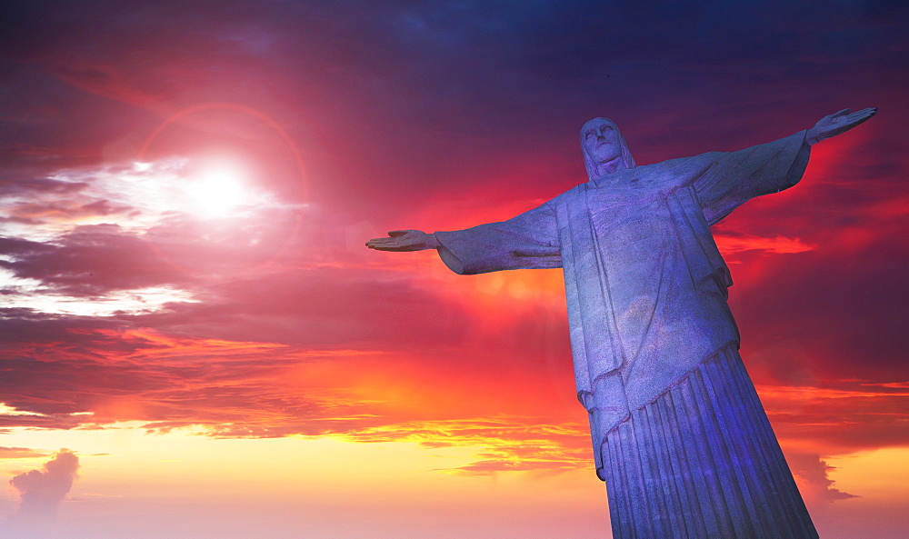 Statue of Christ the Redeemer at sunset, Corcovado, Rio de Janeiro, Brazil, South America