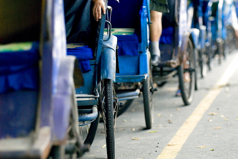 Queue of pedal taxis, Leshan, Sichuan, China, Asia