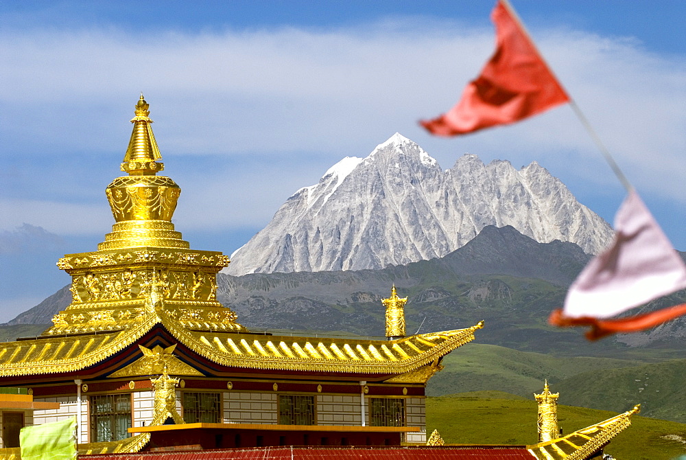 Snow mountain and Buddhist temple, Tagong Grasslands, Sichuan, China, Asia